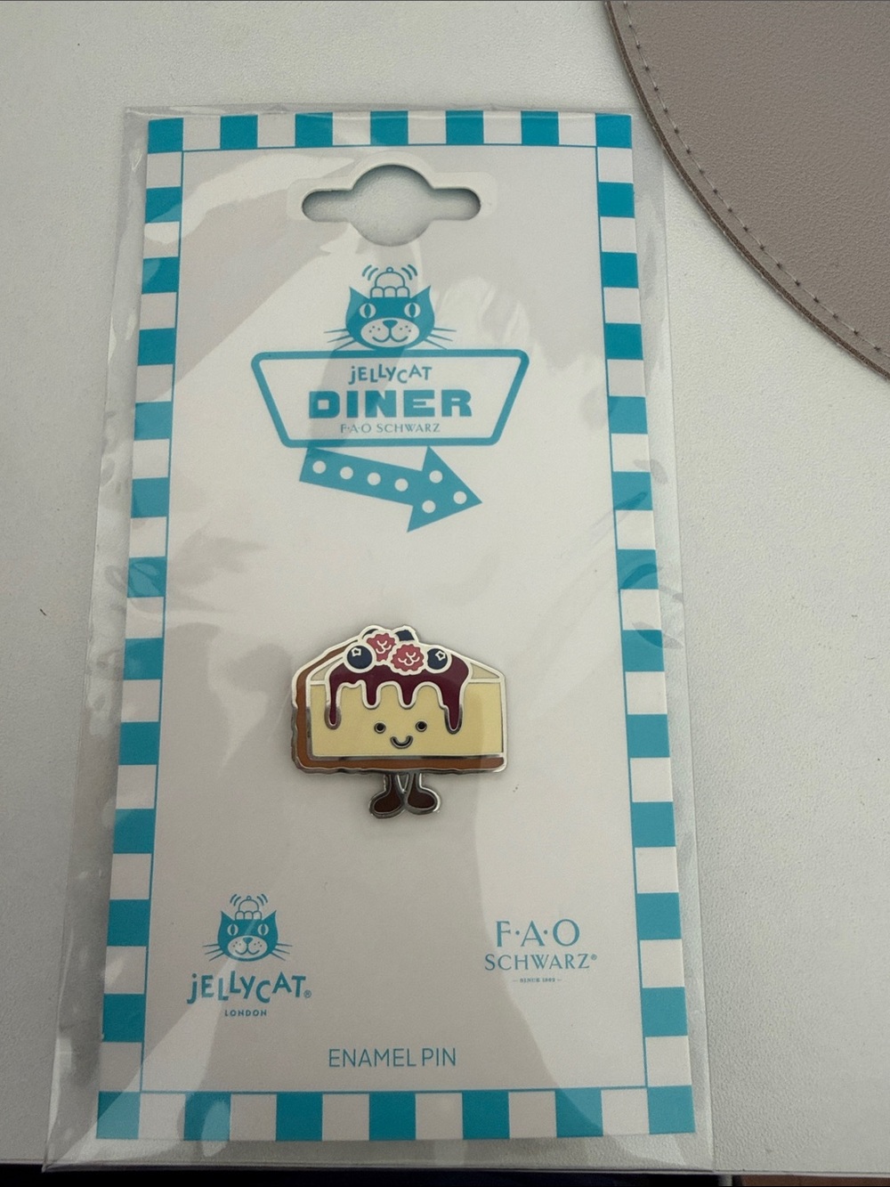 Jellycat Yellow Cake Enamel Pin with Red Berry Topping